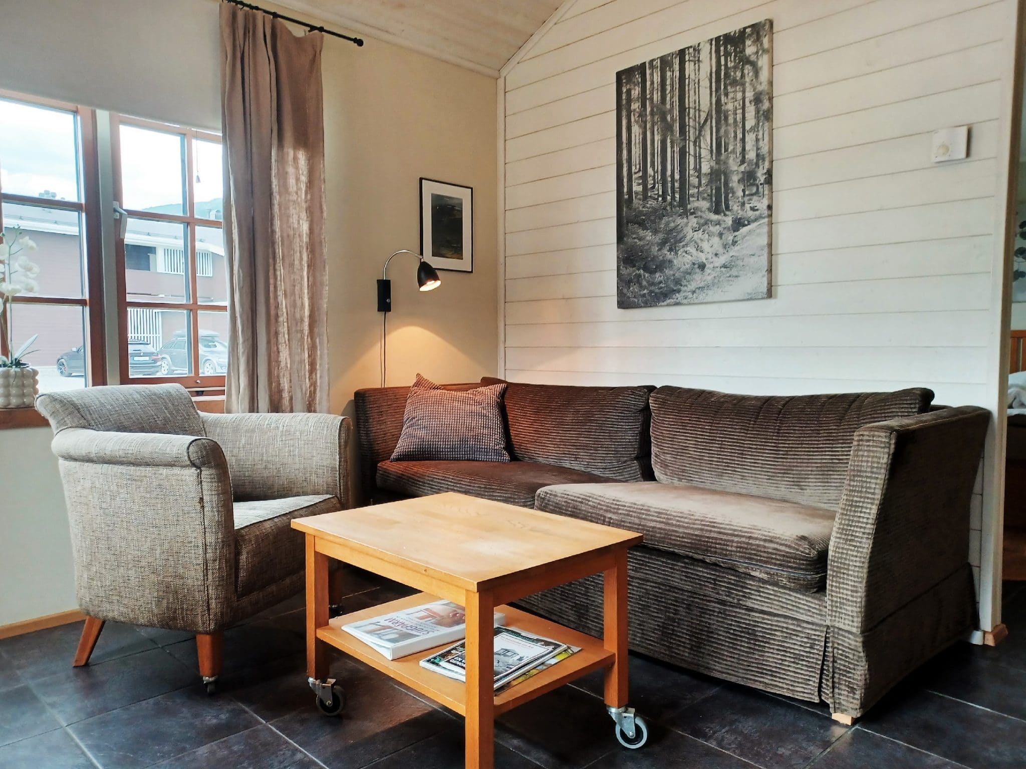 Sofa in living room in Drömstugan in Åre