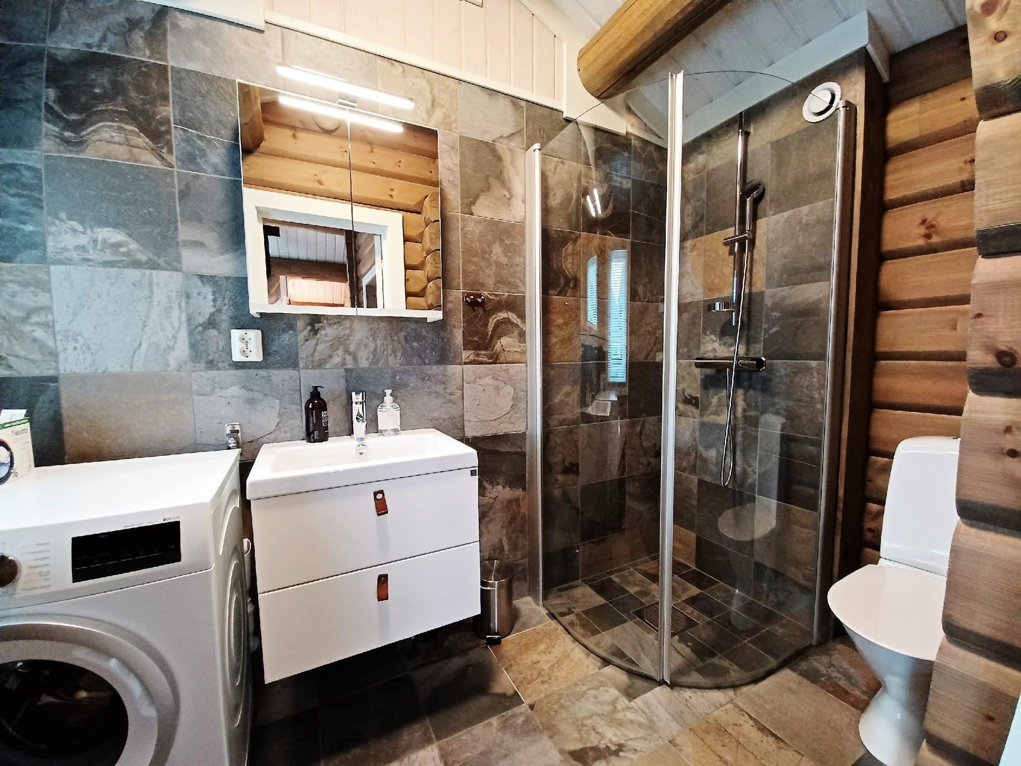 Bathroom with wooden walls and tiles.